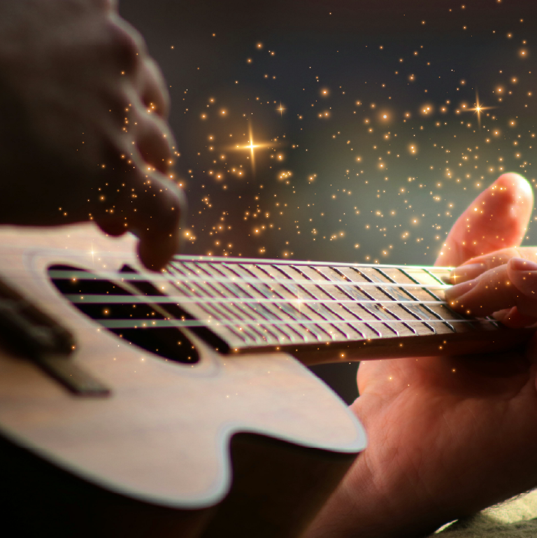 Sparkly lights hover over a ukulele being played.